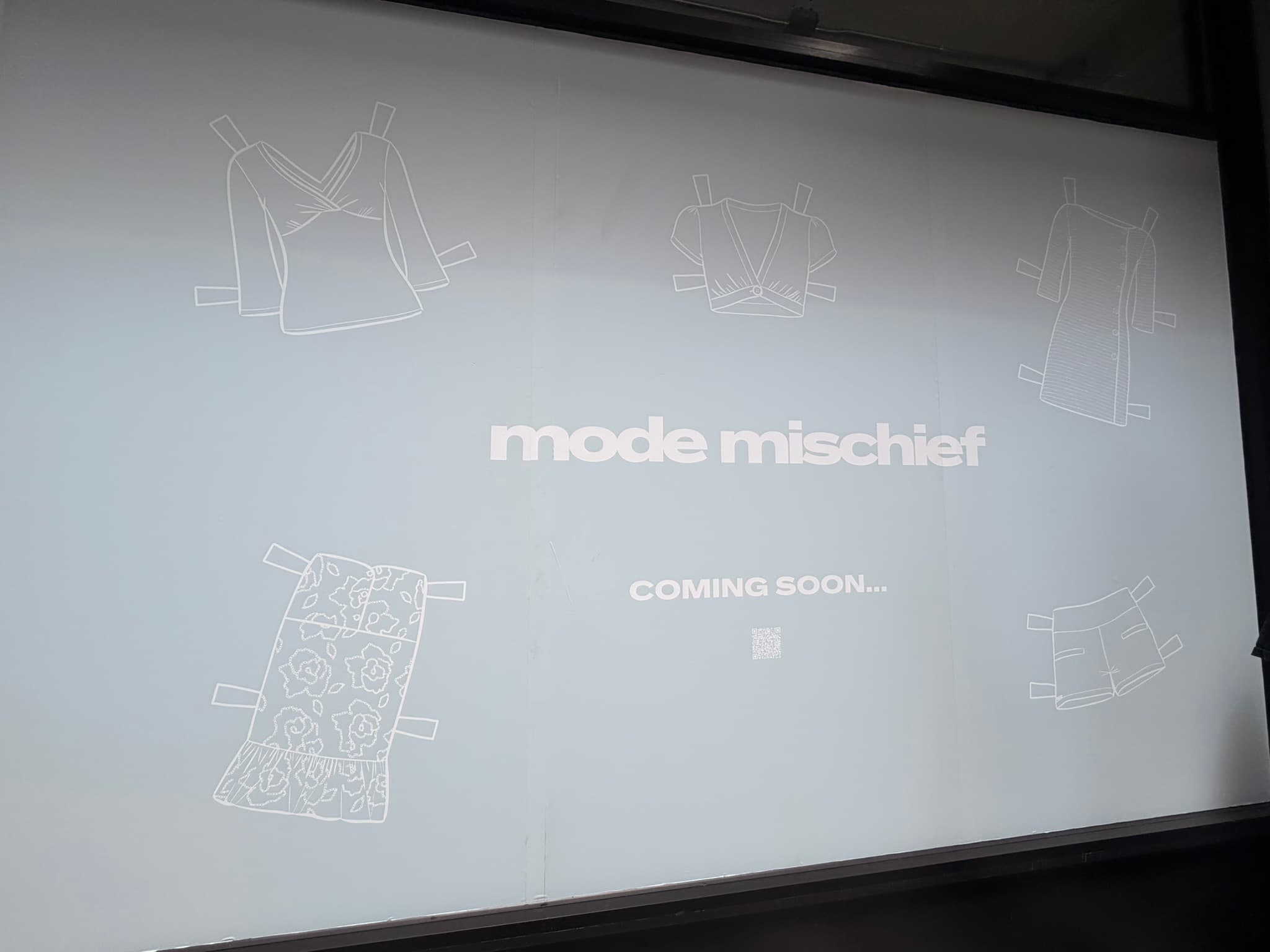Mode Mischief storefront window graphics and coming soon branding installation